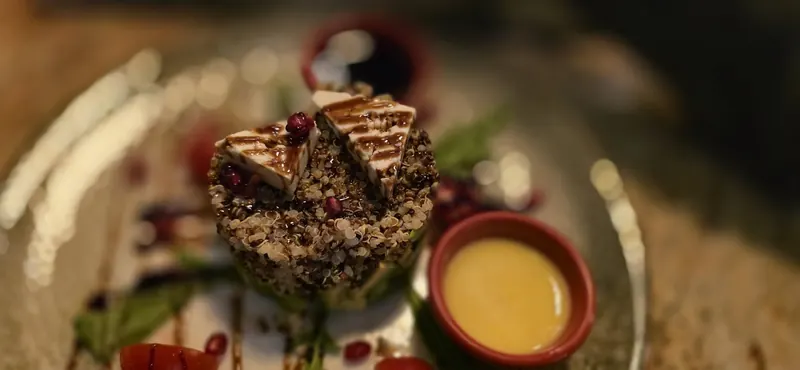 A quinoa stack with grilled cheese and a citrus dressing